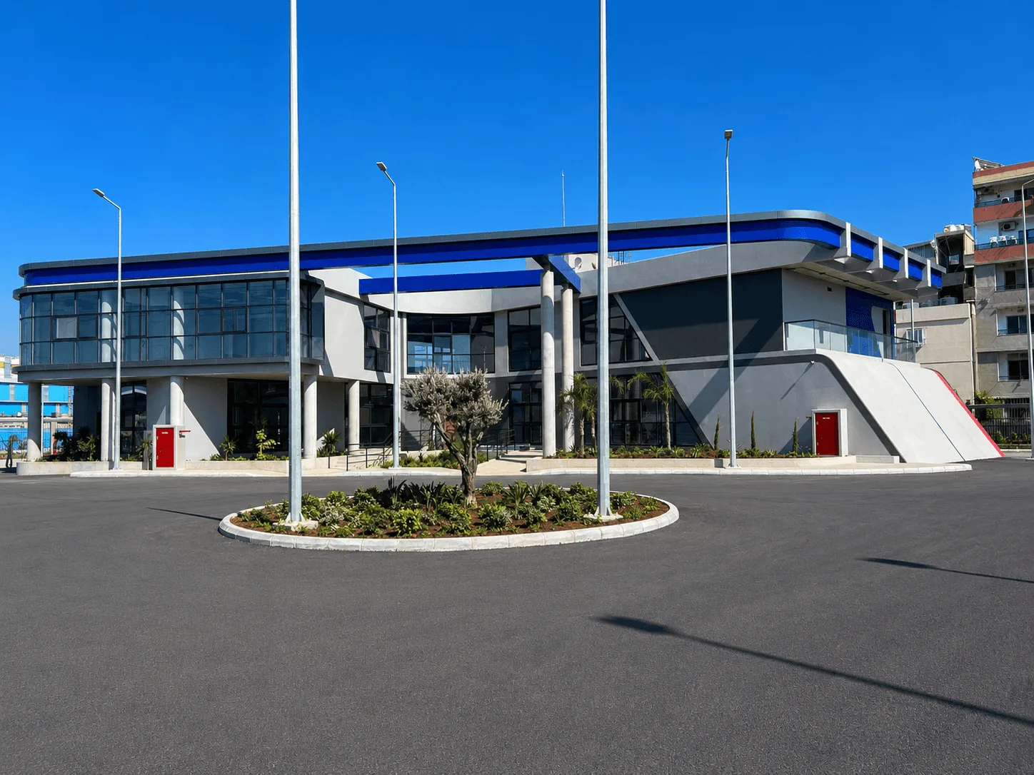 Administration building seen across the forecourt roundabout