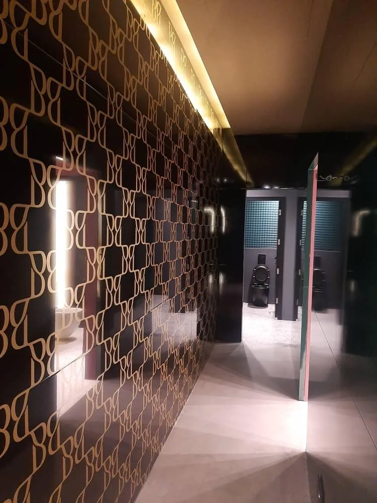 Washroom lobby lined with the club's monogram panelling